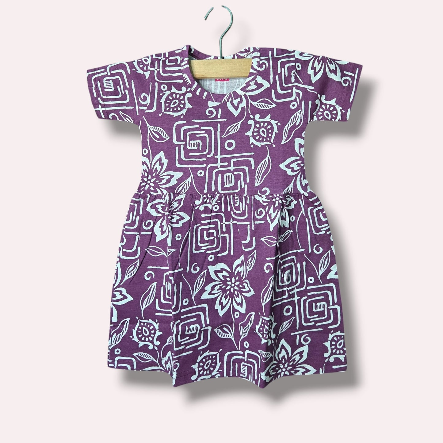 Purple baby short sleeve frock with floral and geometric printed design