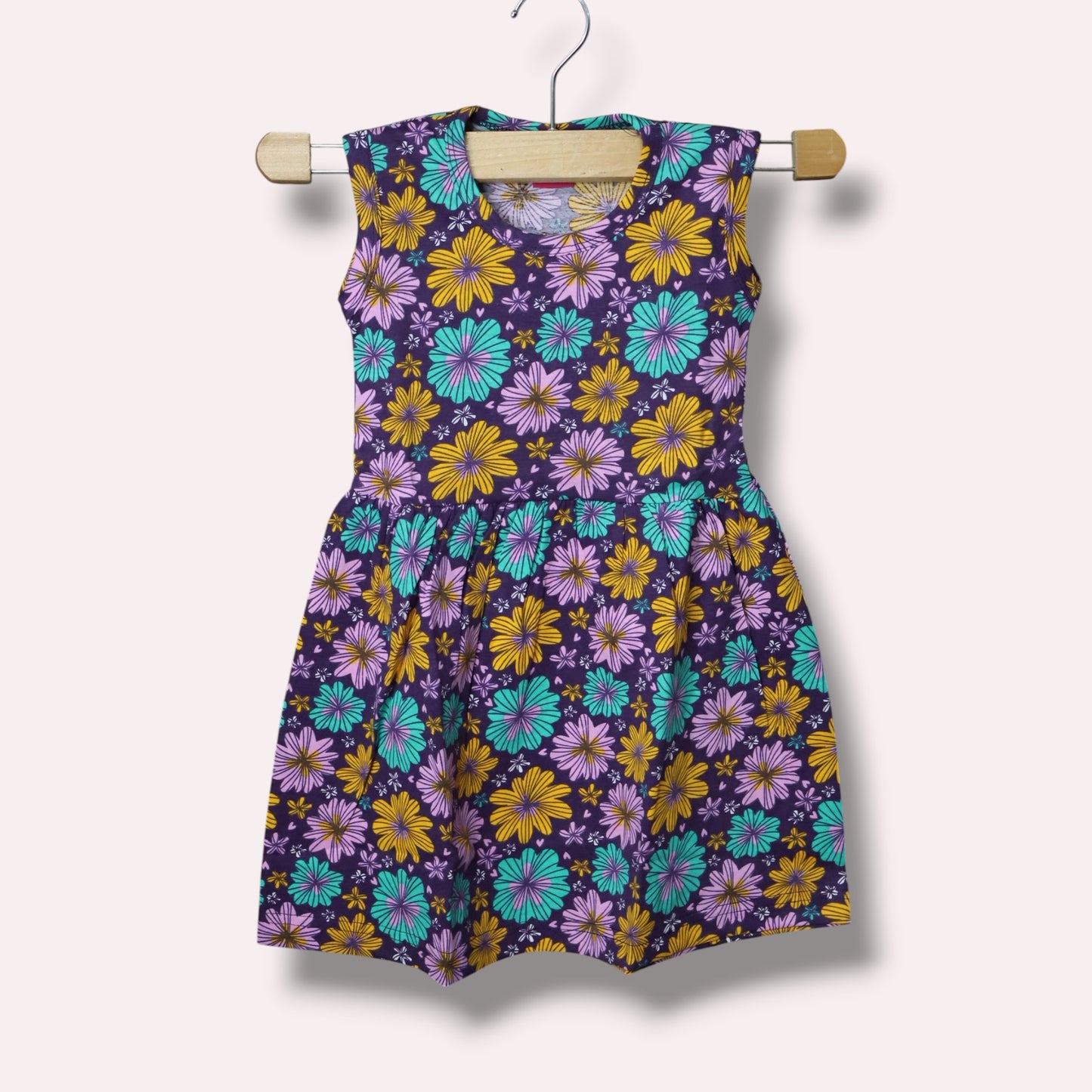 Multicolor baby sleeveless frock with colourful floral printed design