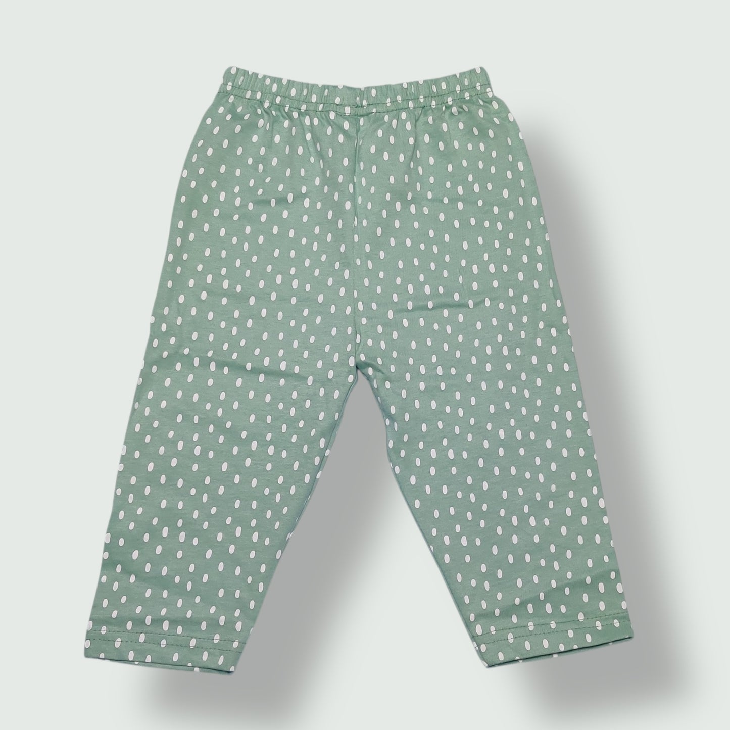 Mint green baby pant with white polka dot print front view