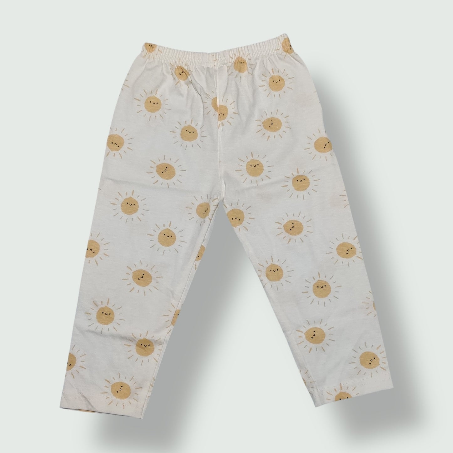 White baby pant with yellow sun printed design front view
