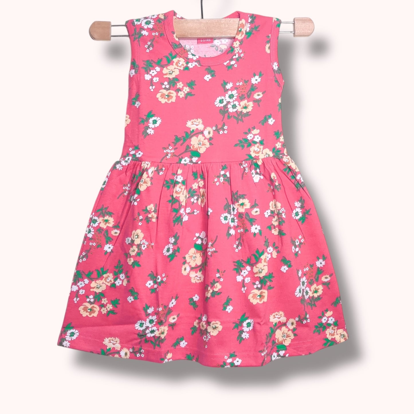 Bloom pink baby frock with multicolor floral printed design