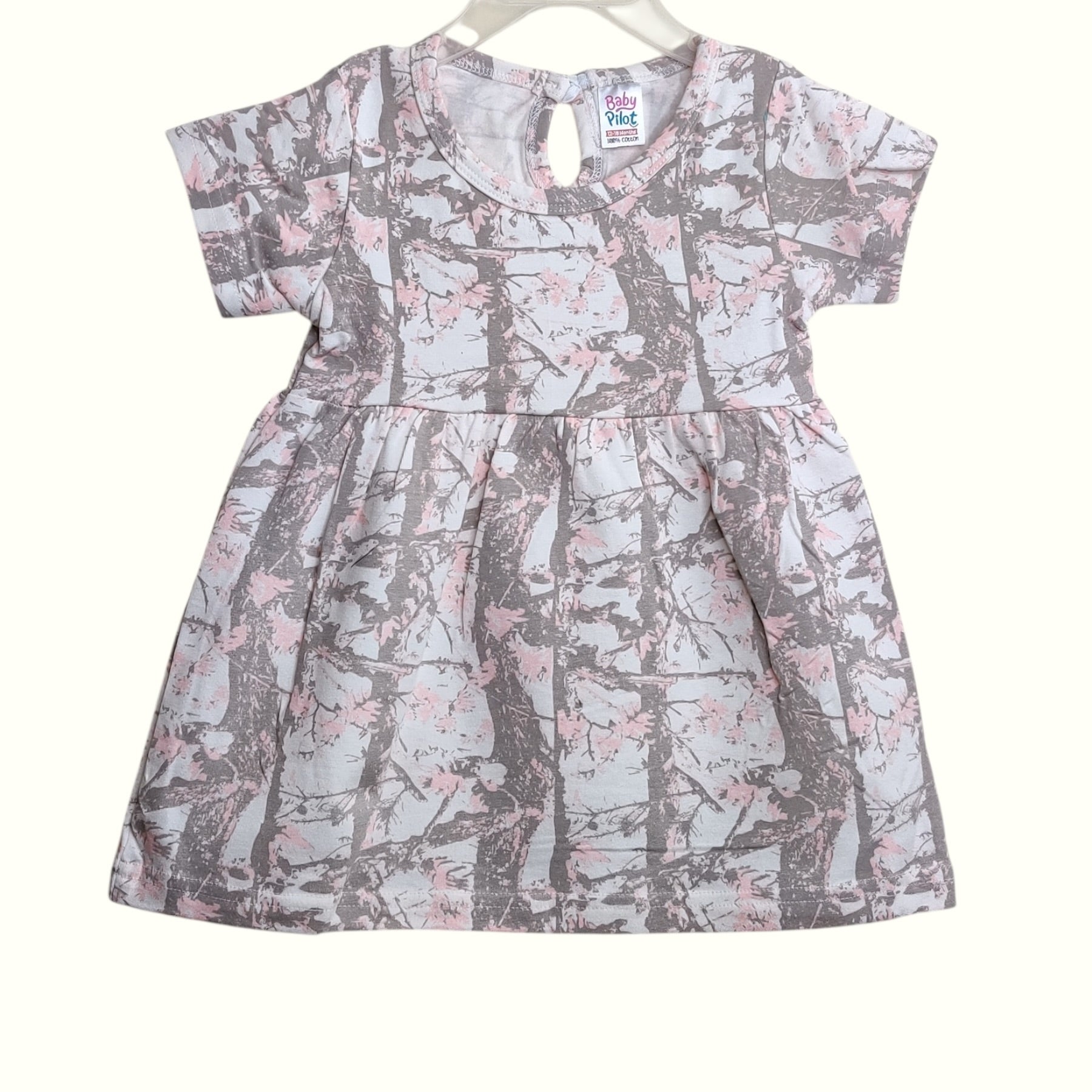 Blush taupe baby frock with printed nature design