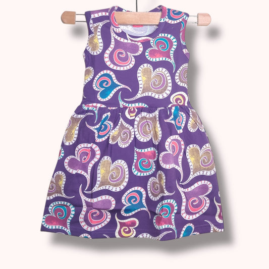 Lavender purple baby frock with multicolor heart swirl printed design