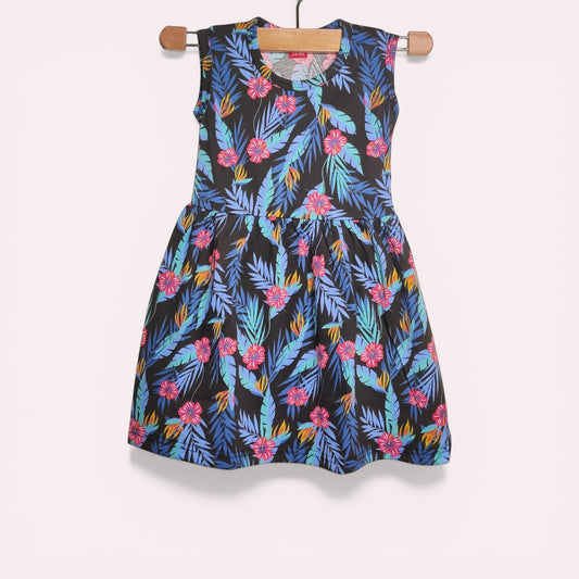 Midnight tropic baby frock with printed floral and leaf design