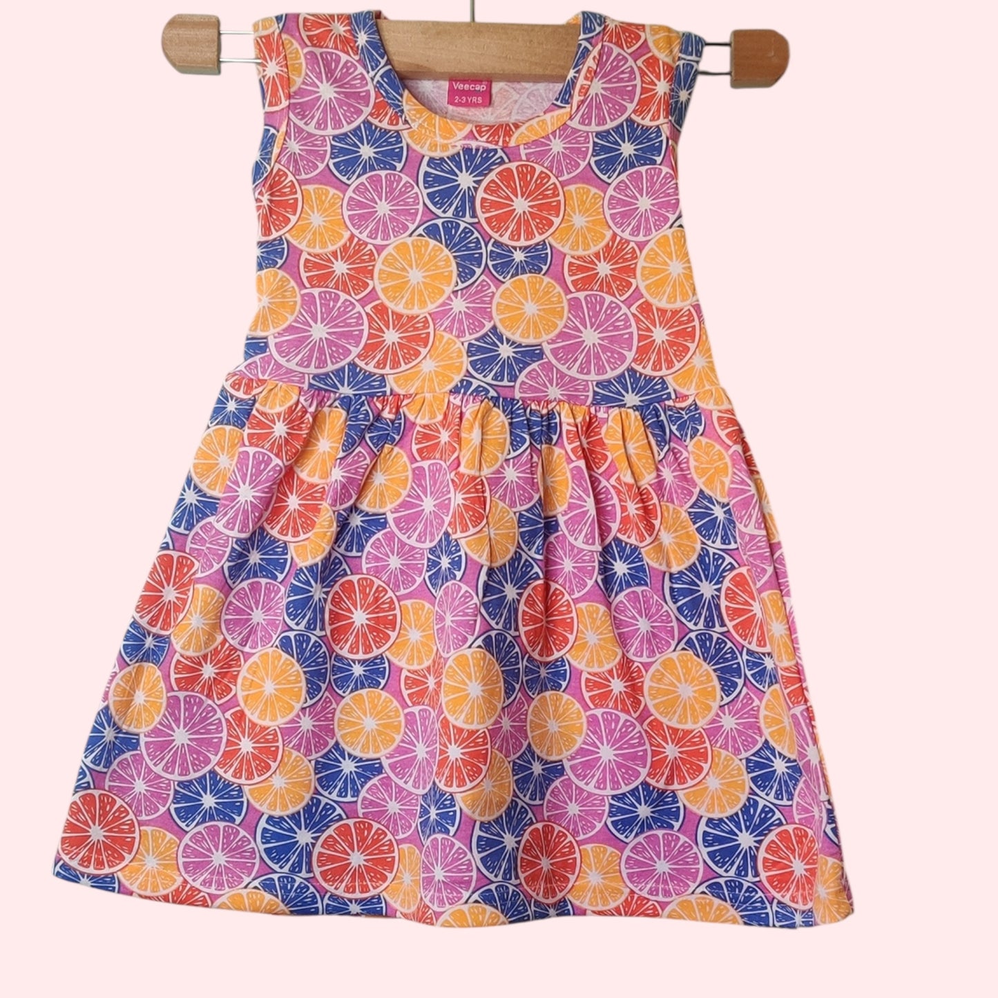 Multicolor baby frock with printed fruit slice design