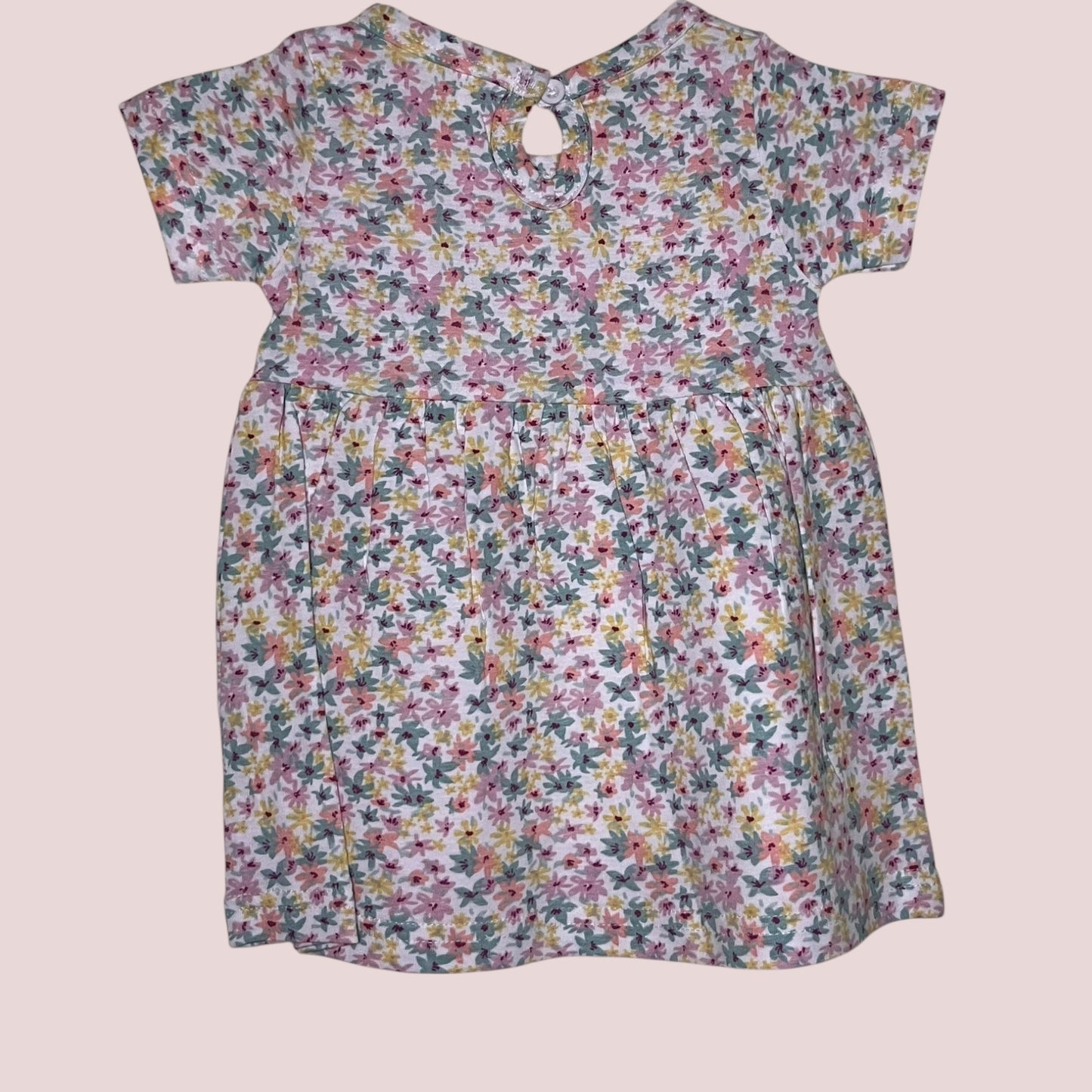 Off-white baby frock with pastel floral print back view