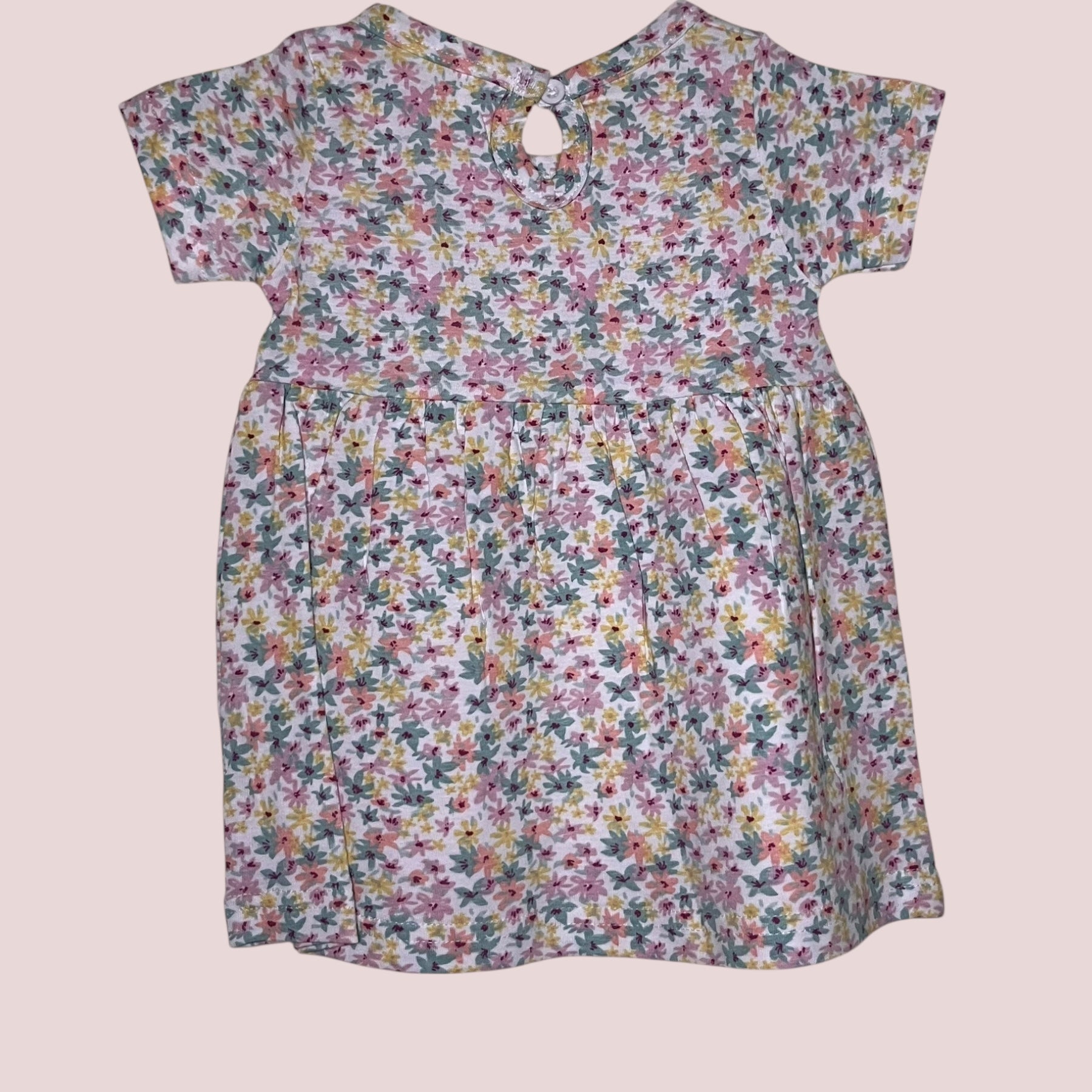 Off-white baby frock with pastel floral print back view