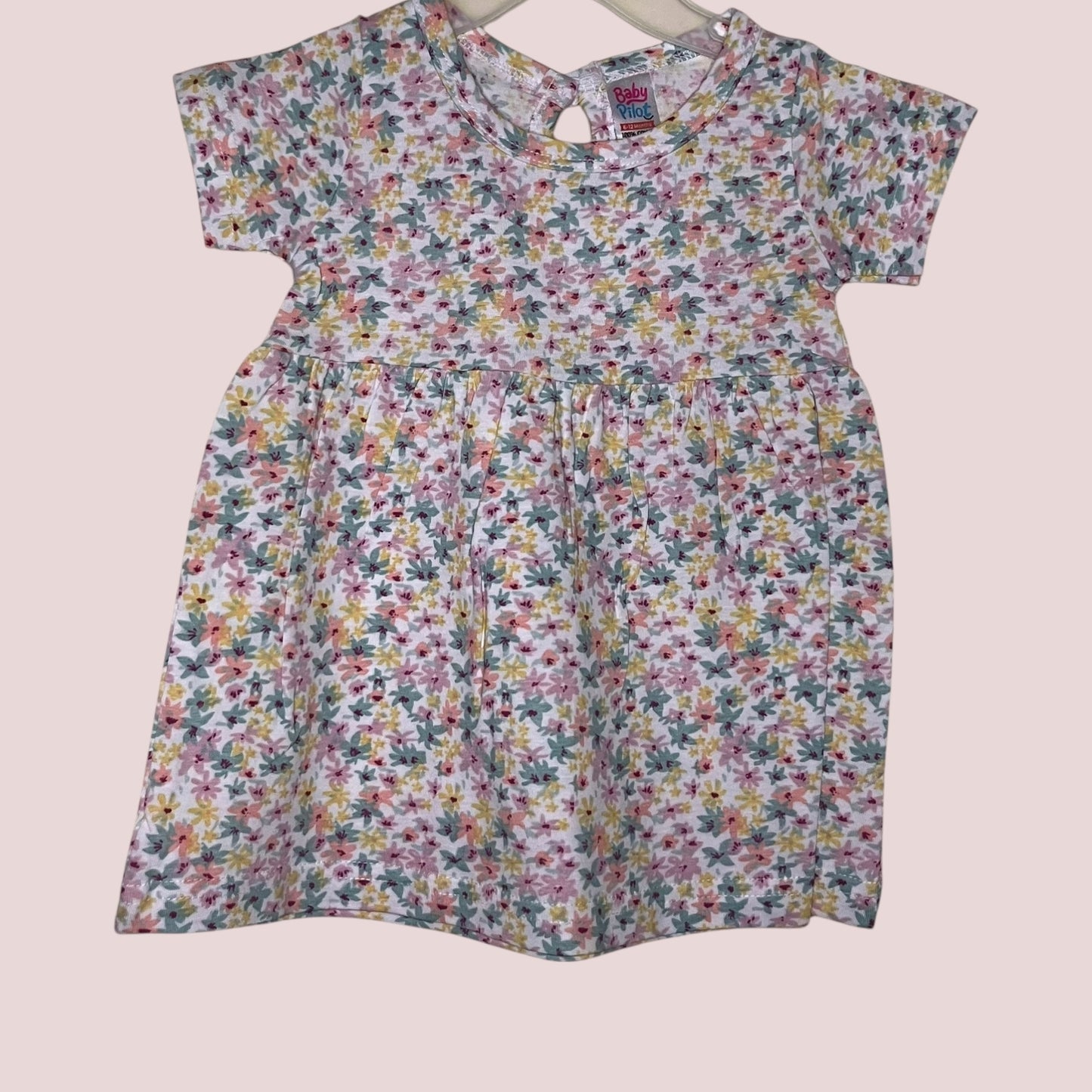 Off-white baby frock with pastel floral print front view