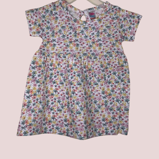 Off-white baby frock with pastel floral print front view