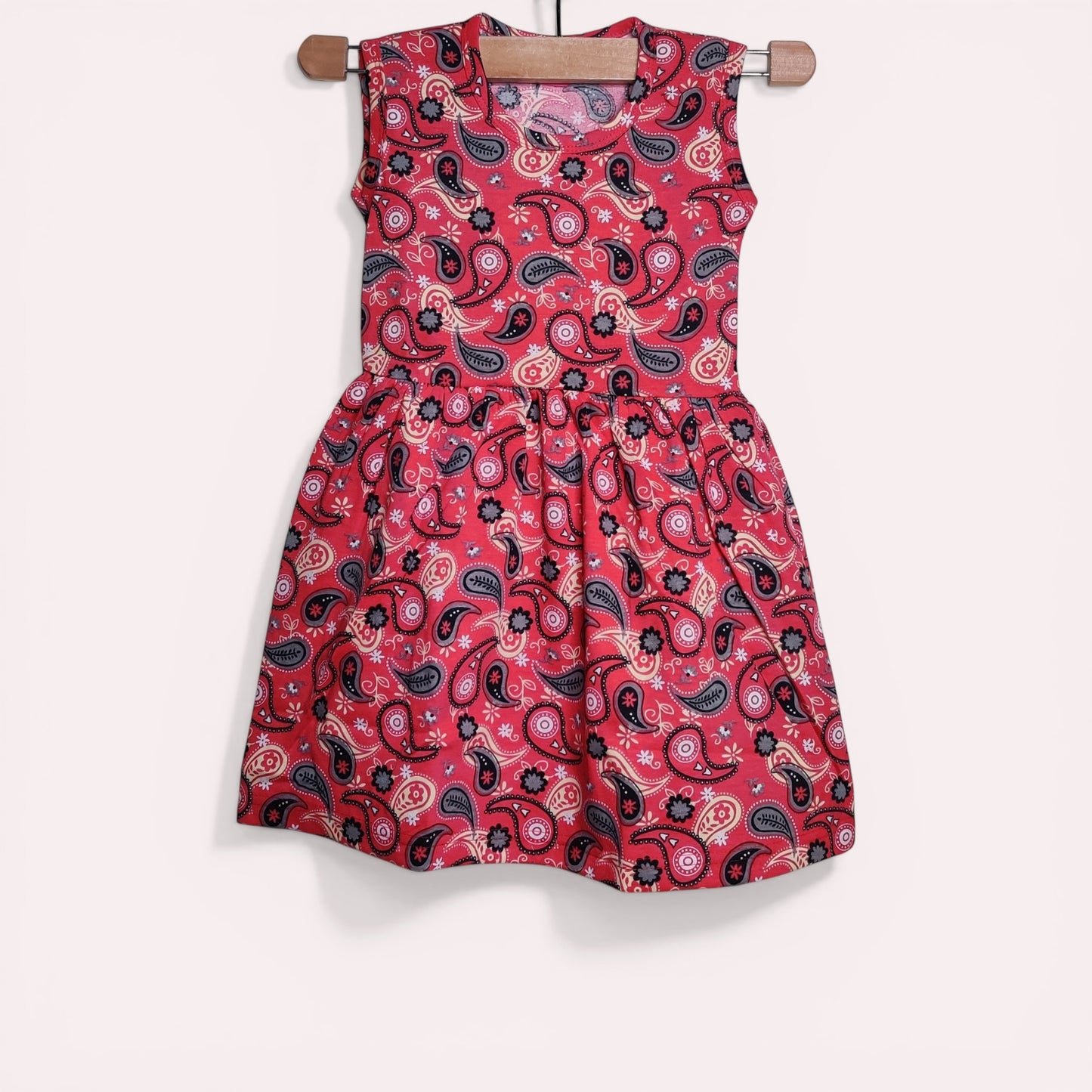 Red berry baby frock with printed paisley design