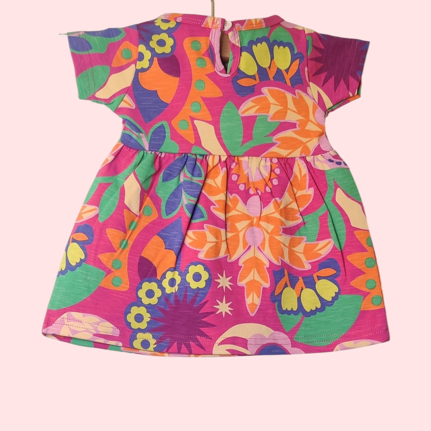 Baby girl frock back – warm pink with floral print and snap