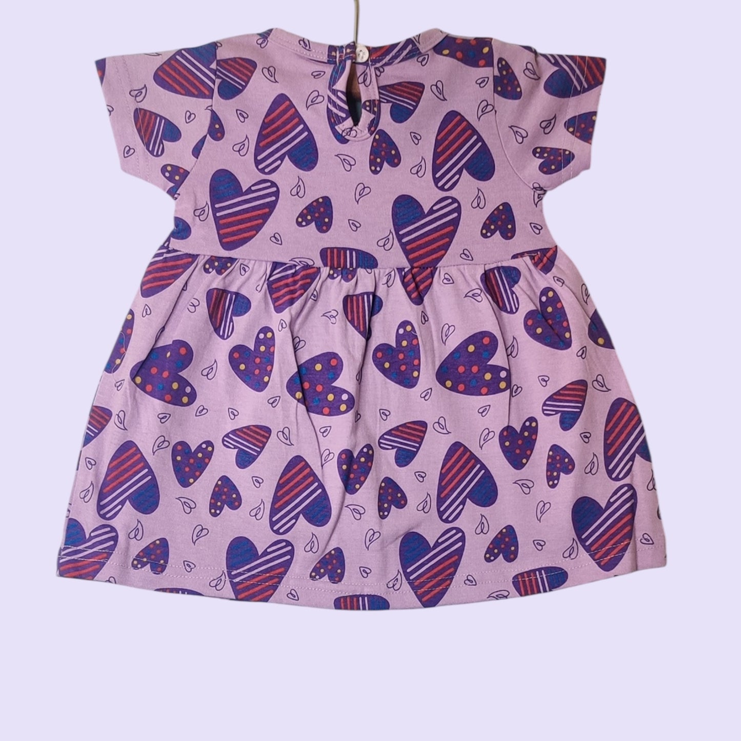 Baby girl soft cotton frock in lilac with heart print with snap closure