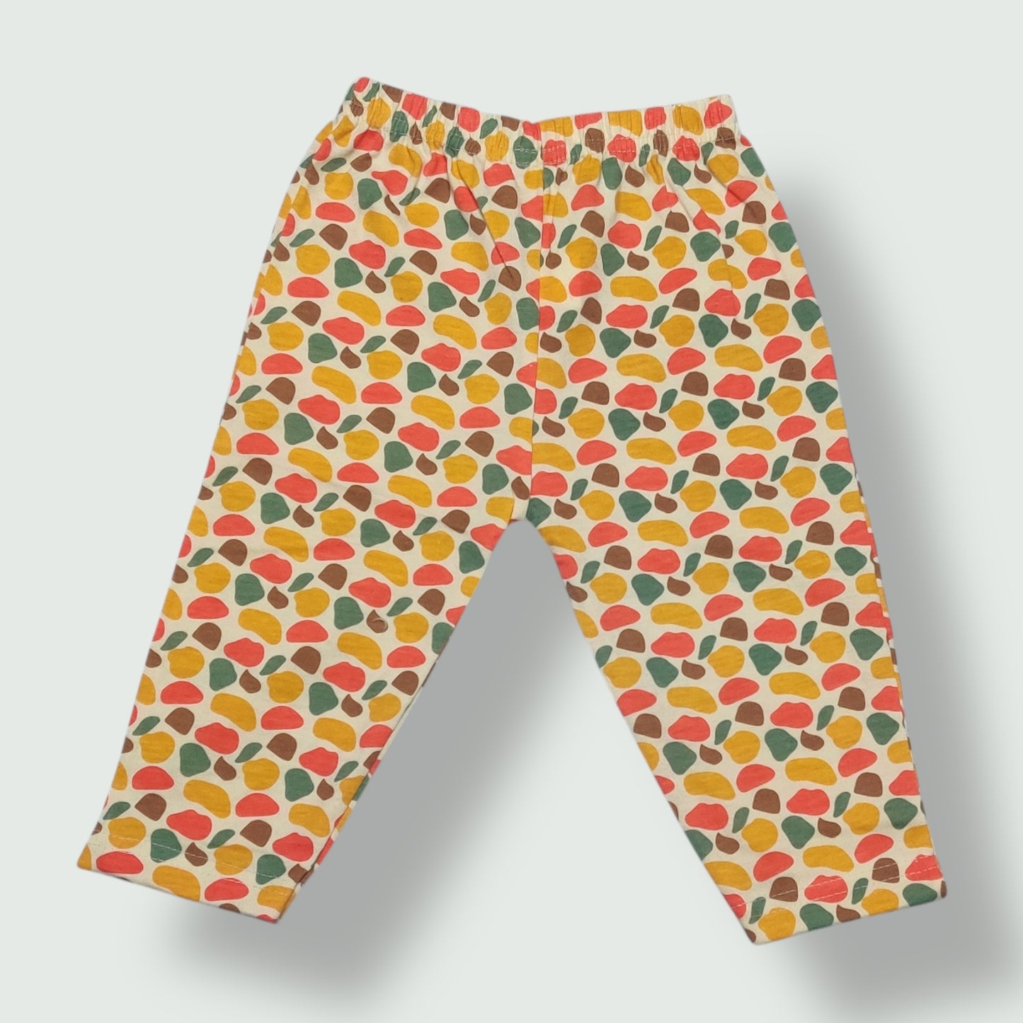Creamy beige cotton baby pant with abstract multicolor print front view