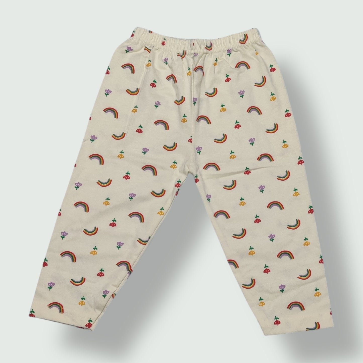 Ivory cream cotton baby pant with rainbow and floral print front view