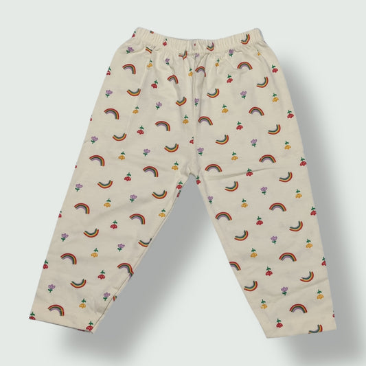 Ivory cream cotton baby pant with rainbow and floral print front view