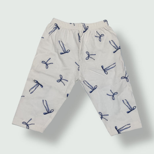 Pearl white cotton baby pant with navy blue bow print front view