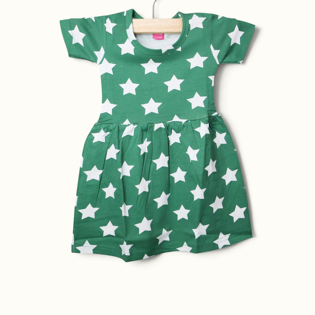 Green baby short sleeve frock with white star printed design.