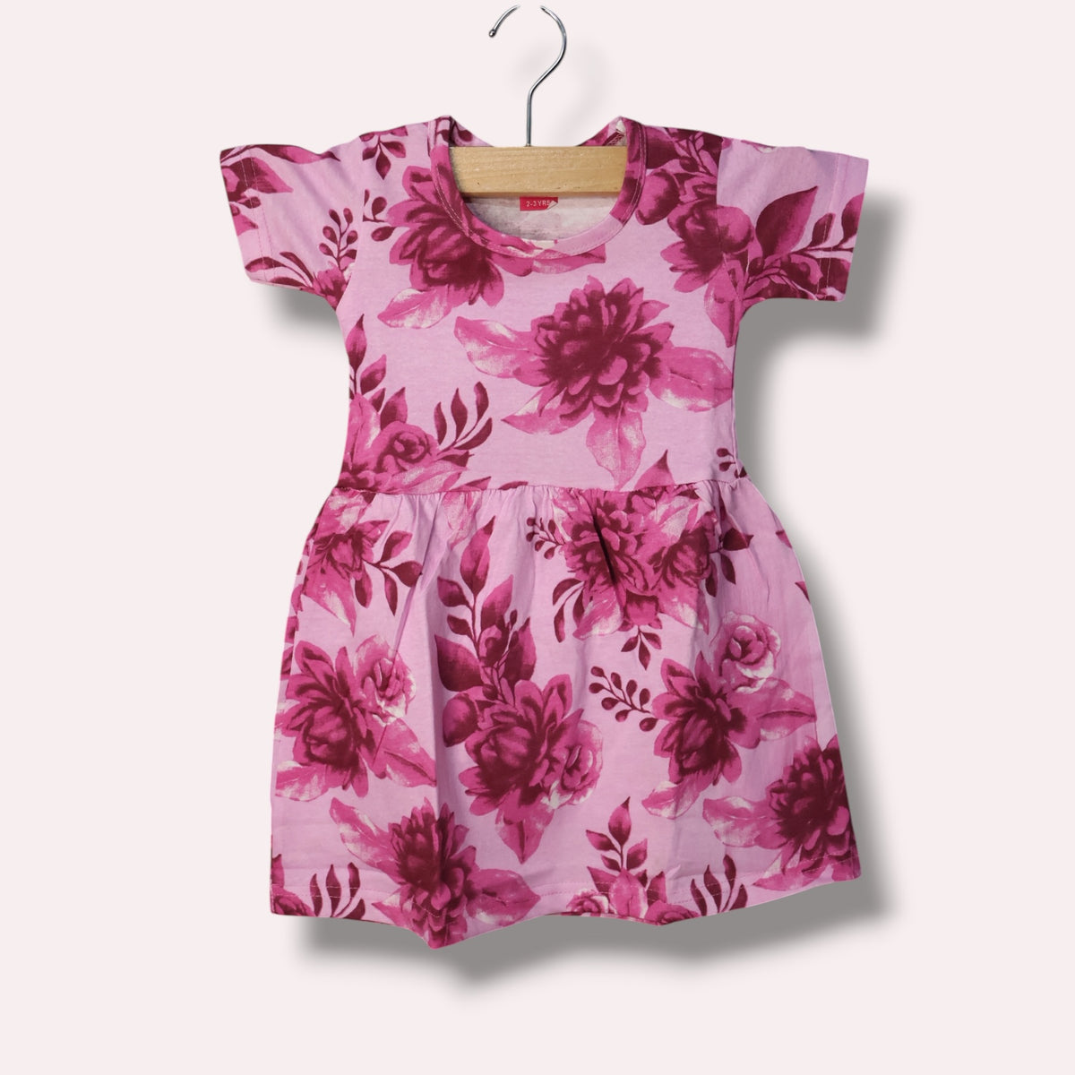 Pink baby short sleeve frock with floral and leafy printed design