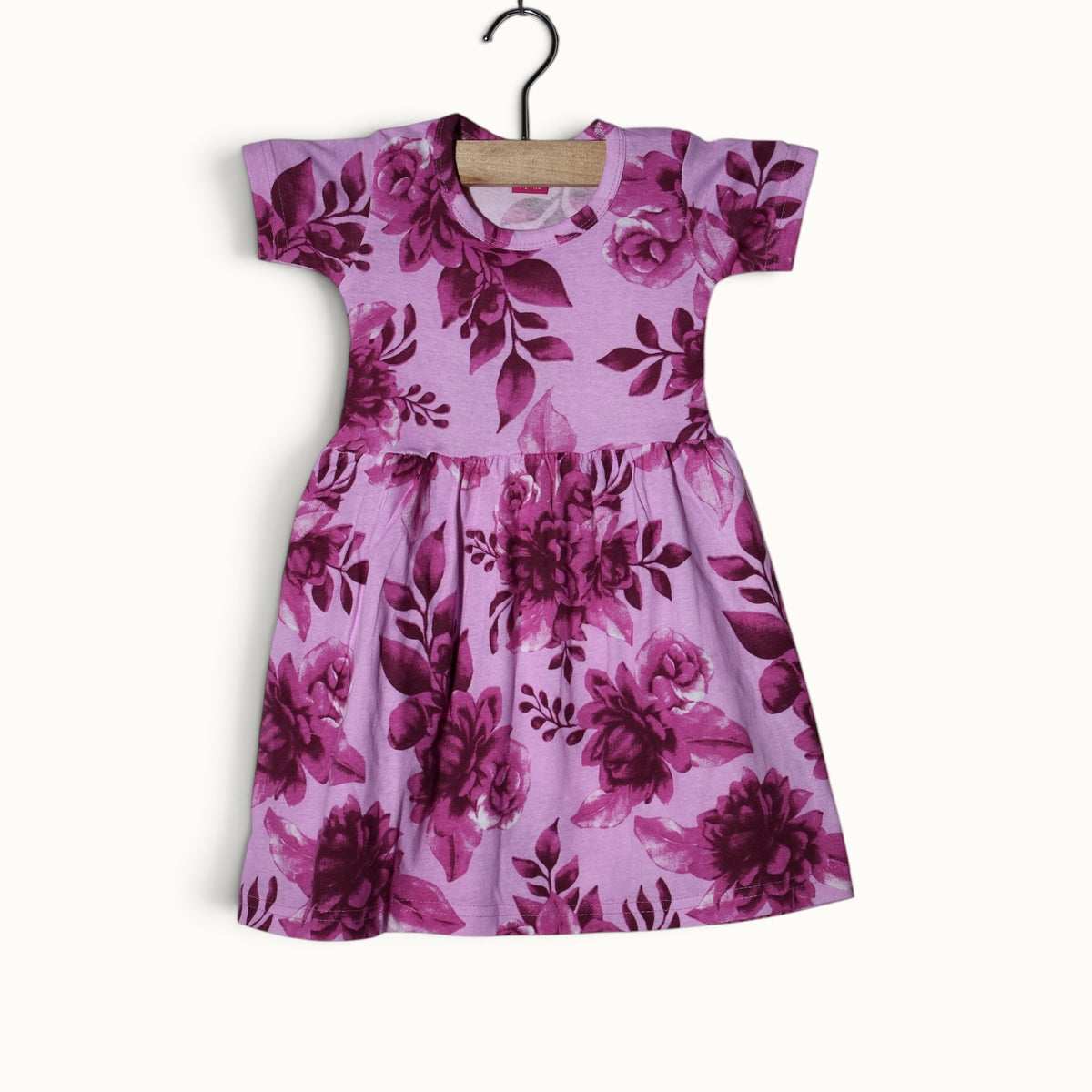 Pink baby short sleeve frock with floral and leafy printed design