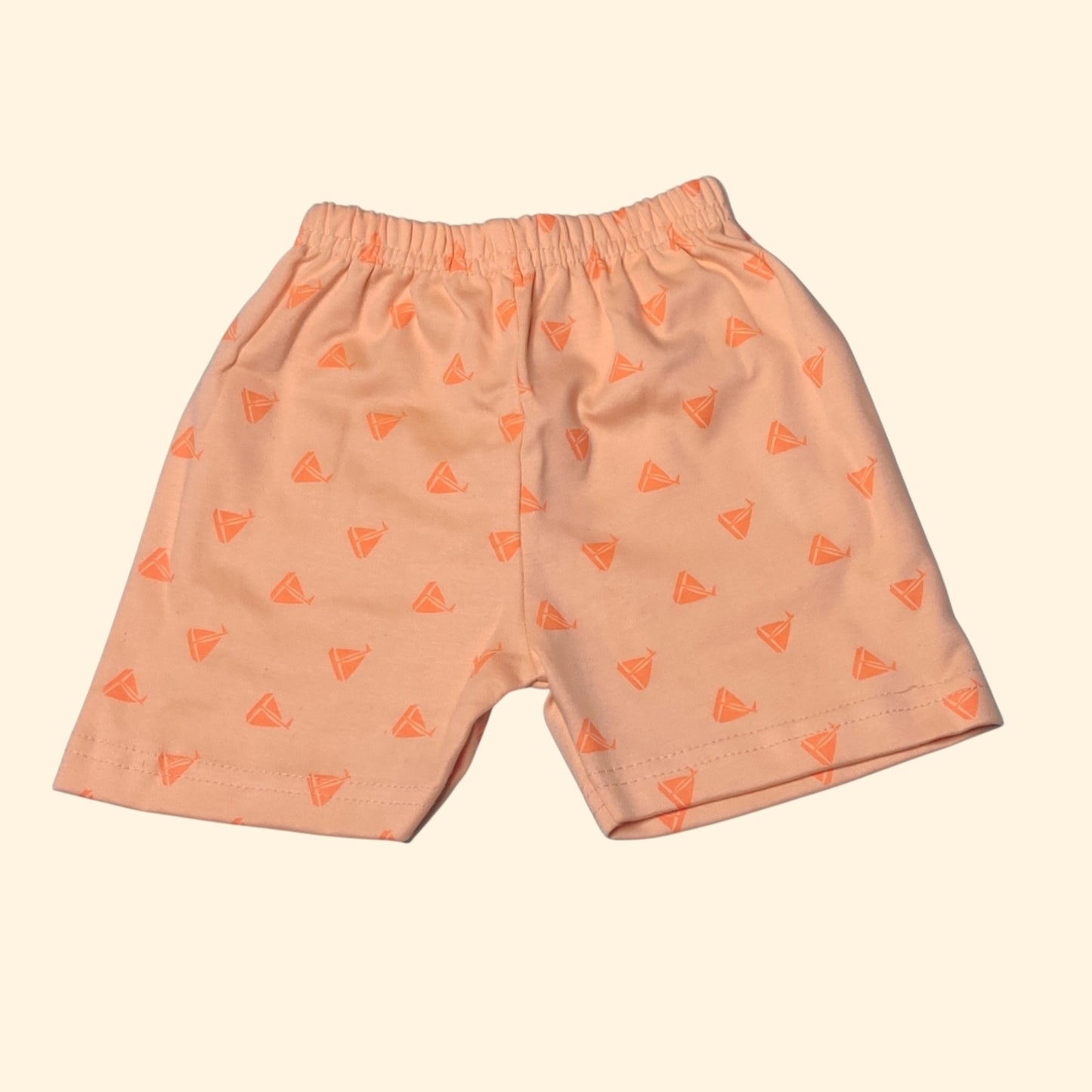 Apricot orange baby shorts with printed pattern