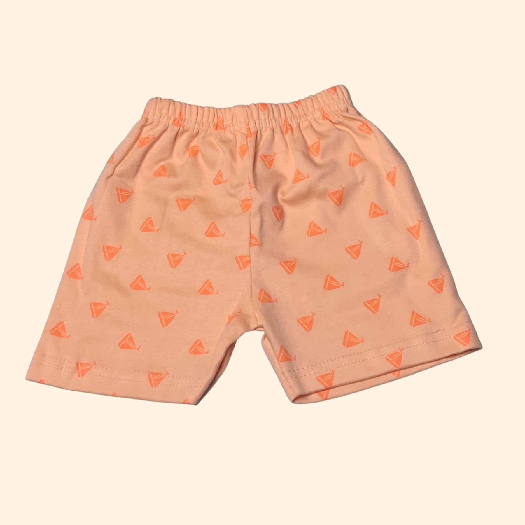 Apricot orange baby shorts with printed pattern