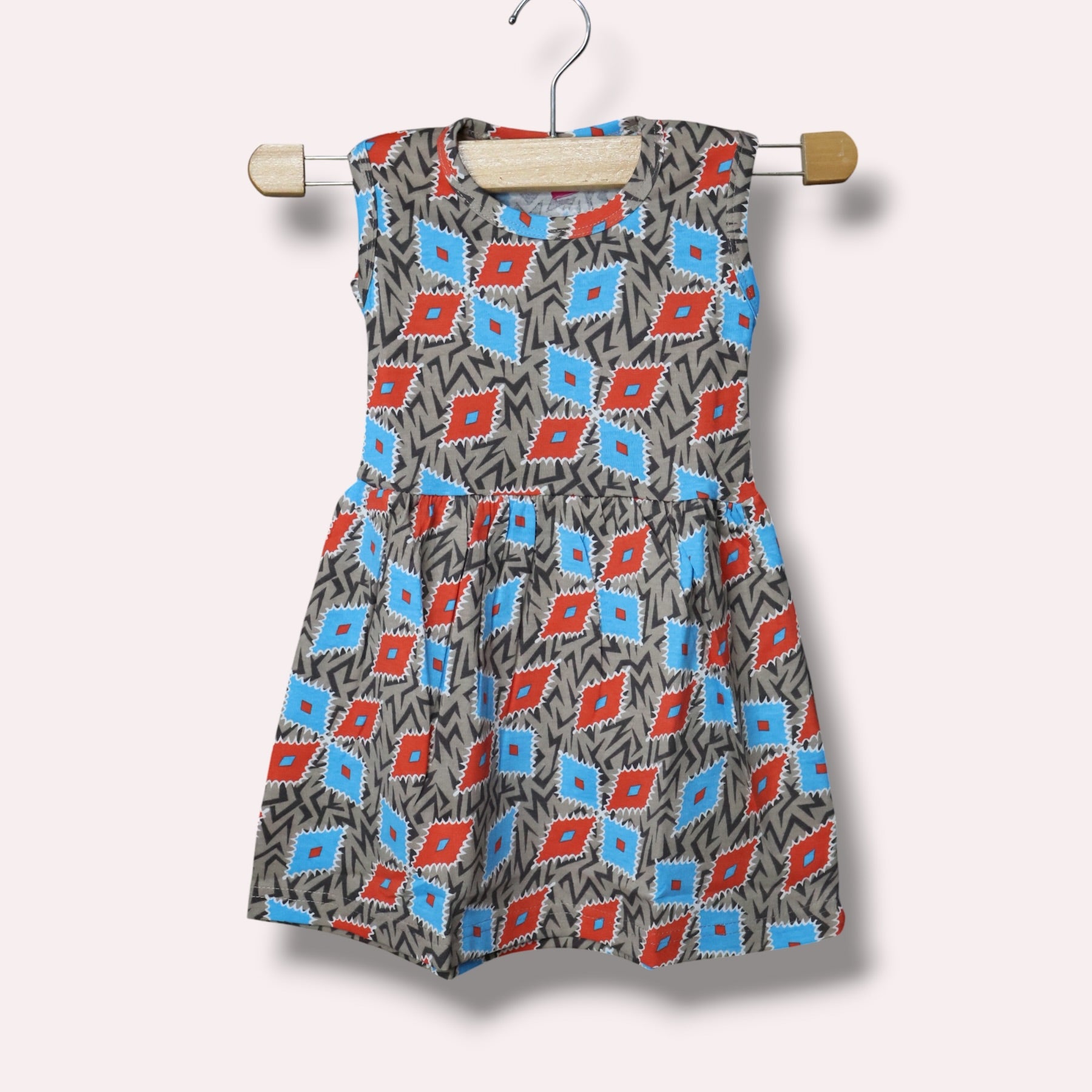 Multicolor baby sleeveless frock with geometric printed design