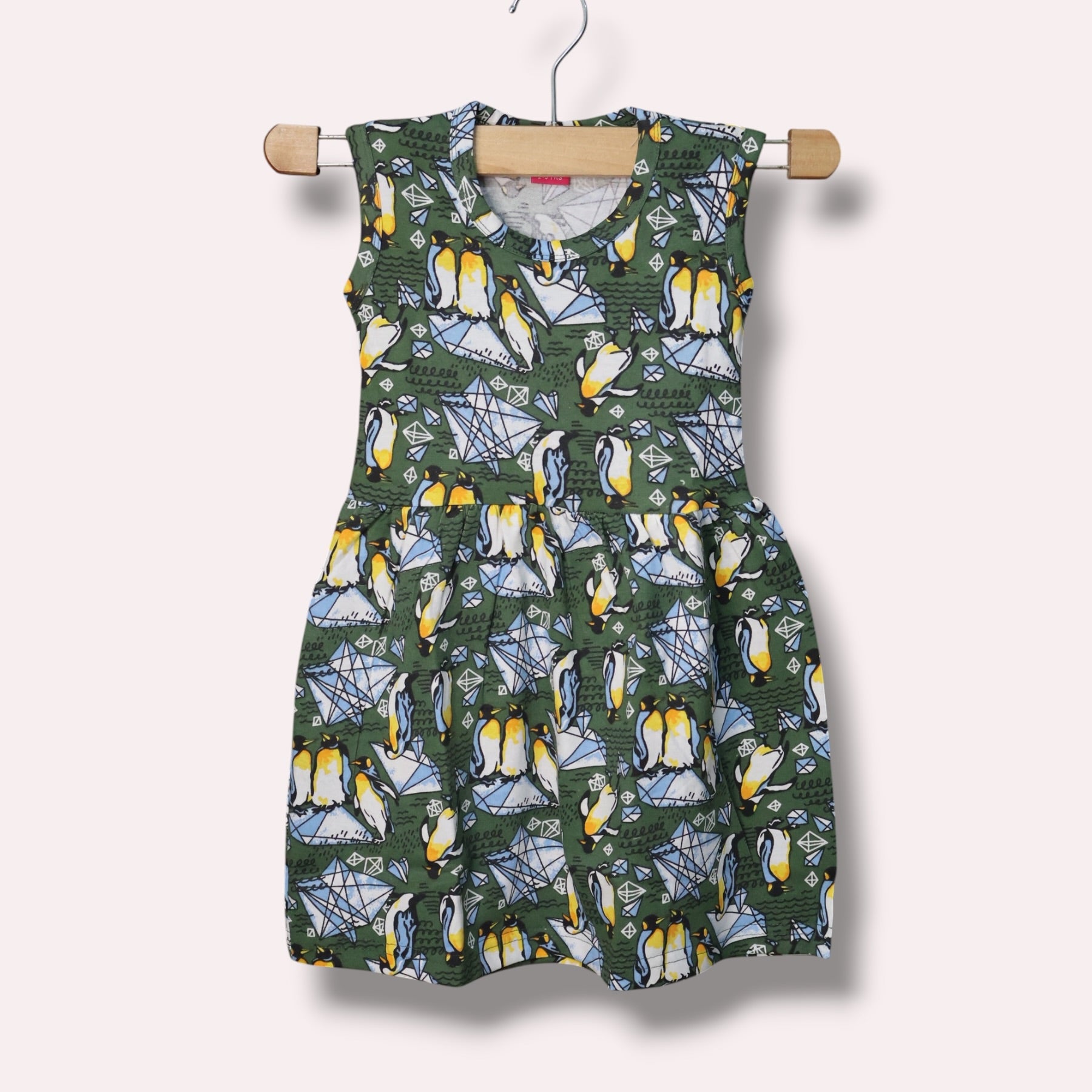 Forest green baby sleeveless frock with penguin and geometric printed design