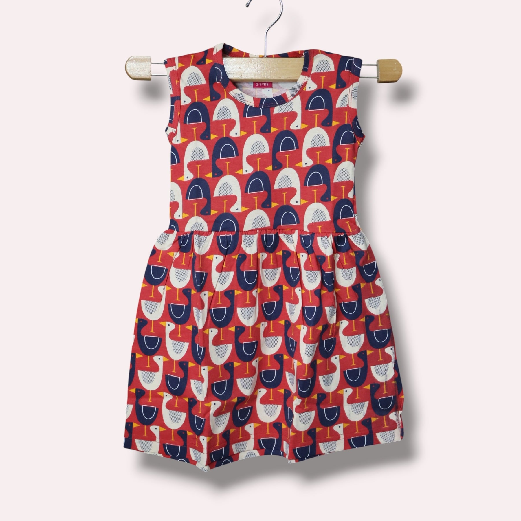 Red baby sleeveless frock with navy blue and white goose printed design