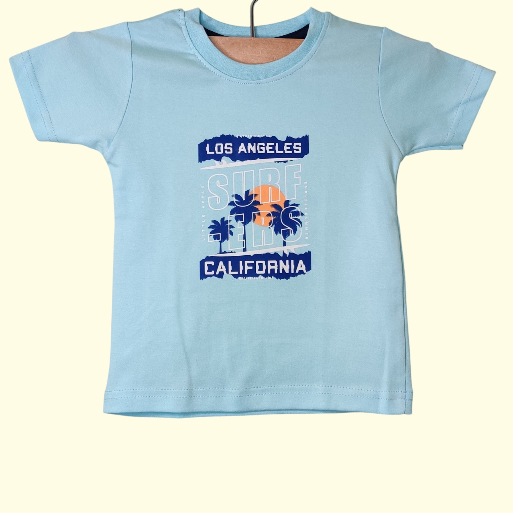 Powder blue baby t-shirt with printed California surfers design
