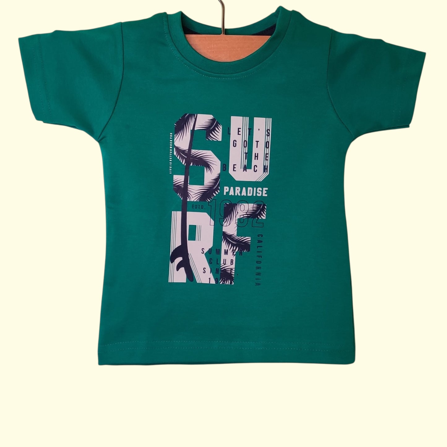 Teal green baby t-shirt with printed surf paradise design