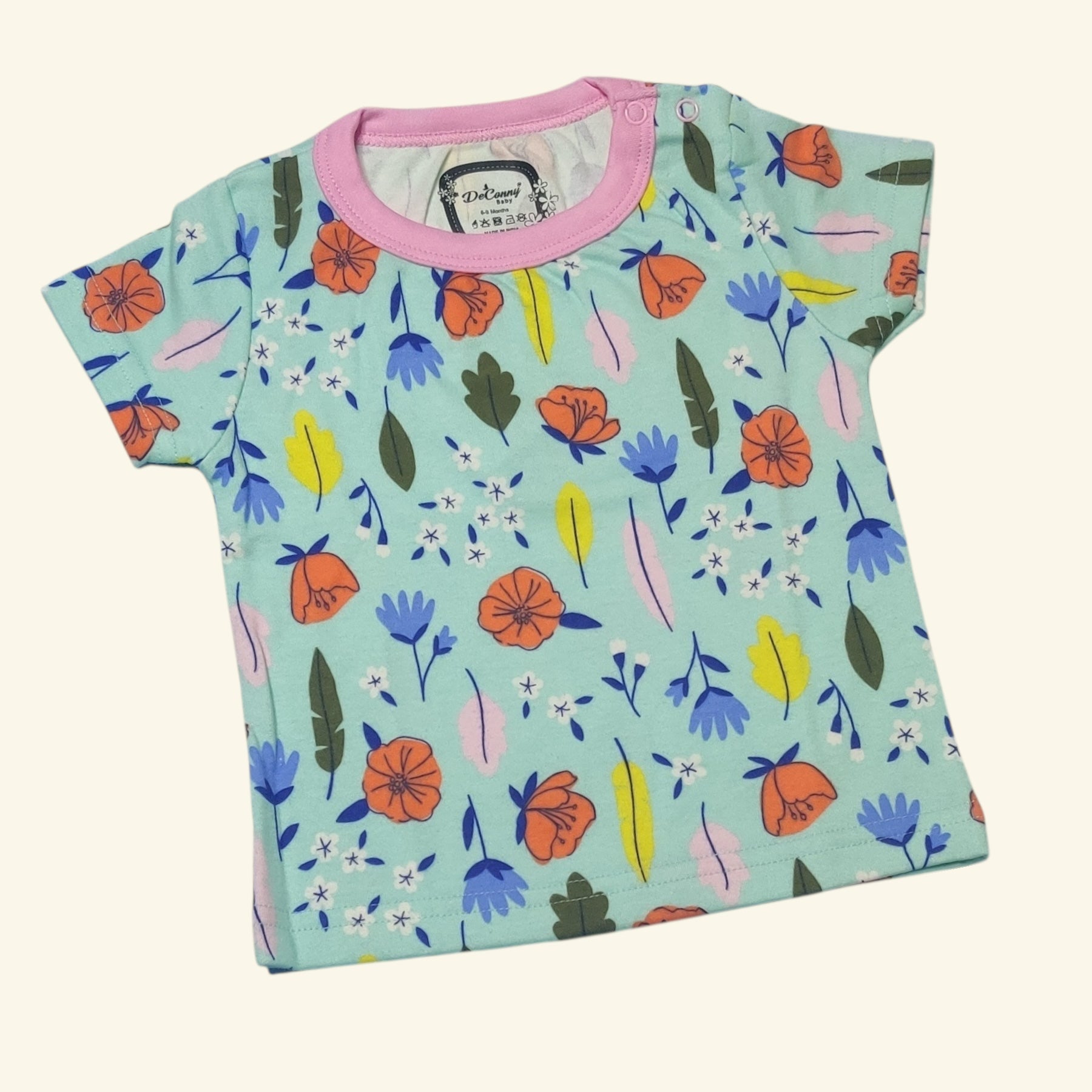Mint green baby girl t-shirt with colorful floral print and pink neckline front view