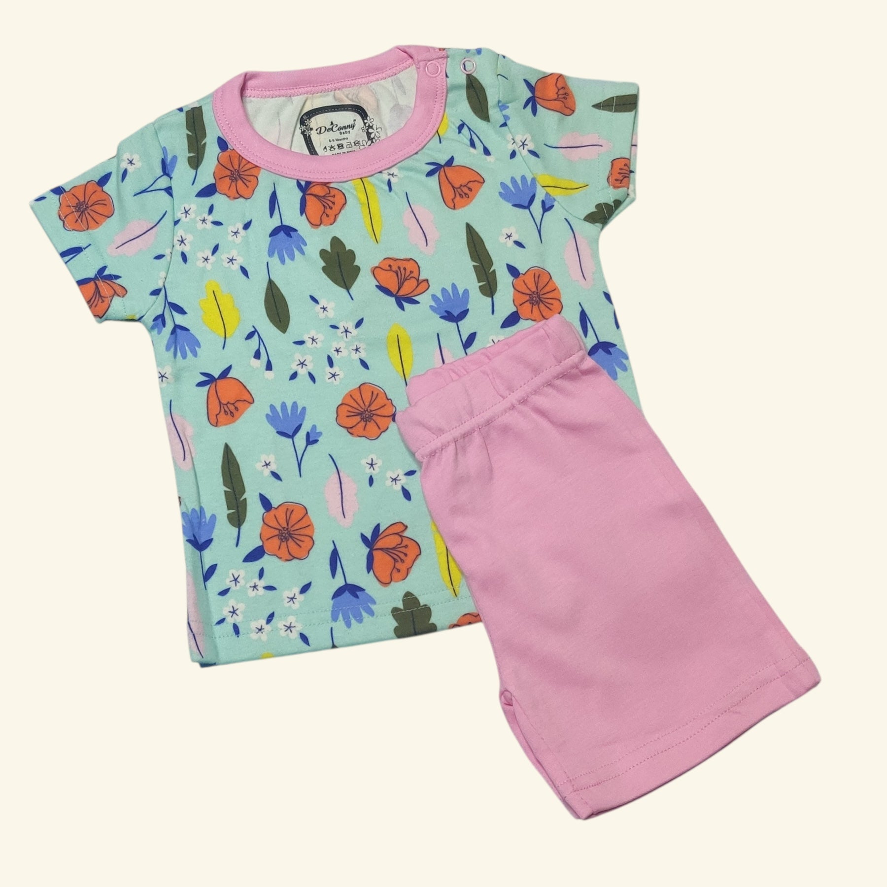 Mint green floral printed baby girl t-shirt with petal pink shorts folded set view