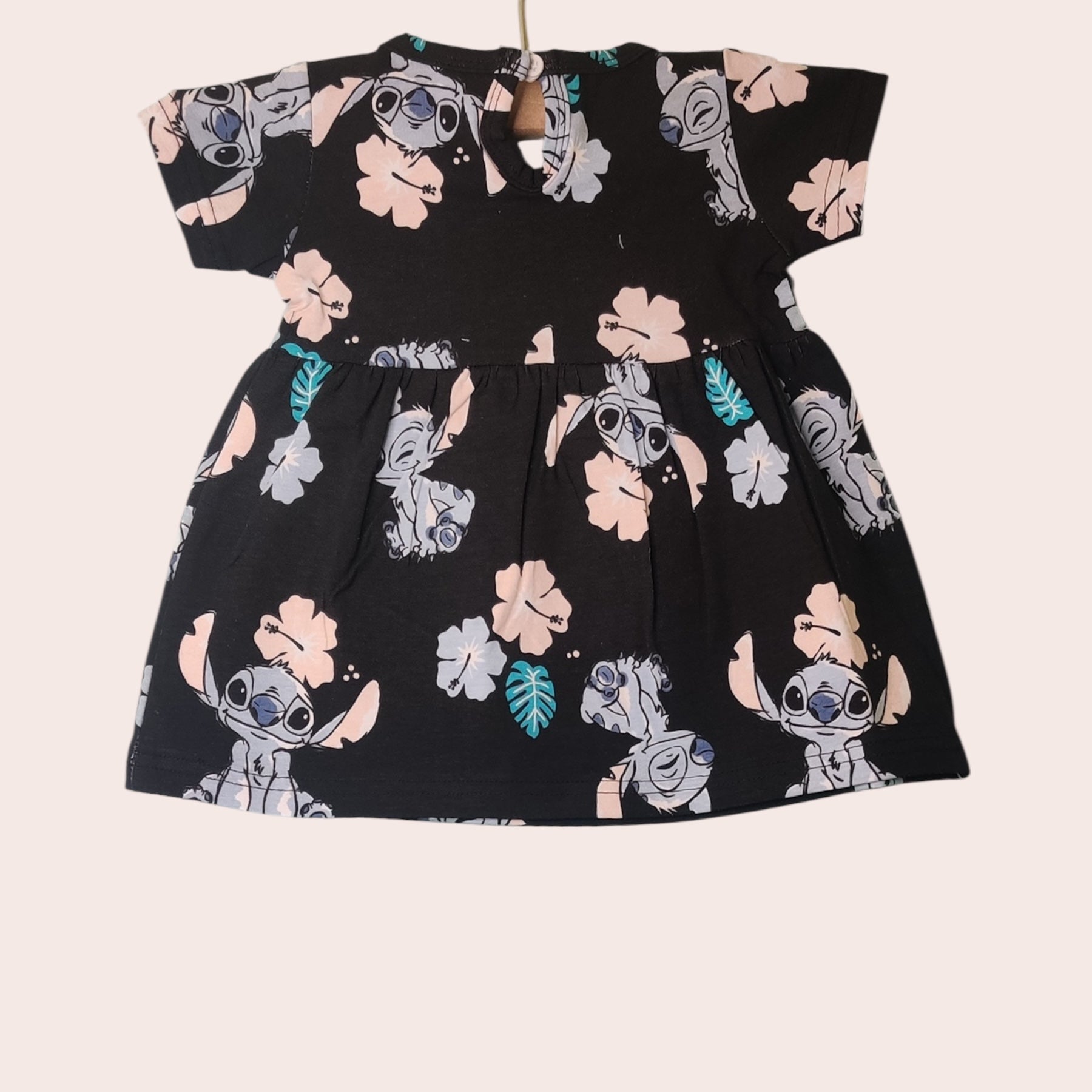 Black cotton baby girl frock with cartoon and snap closure
