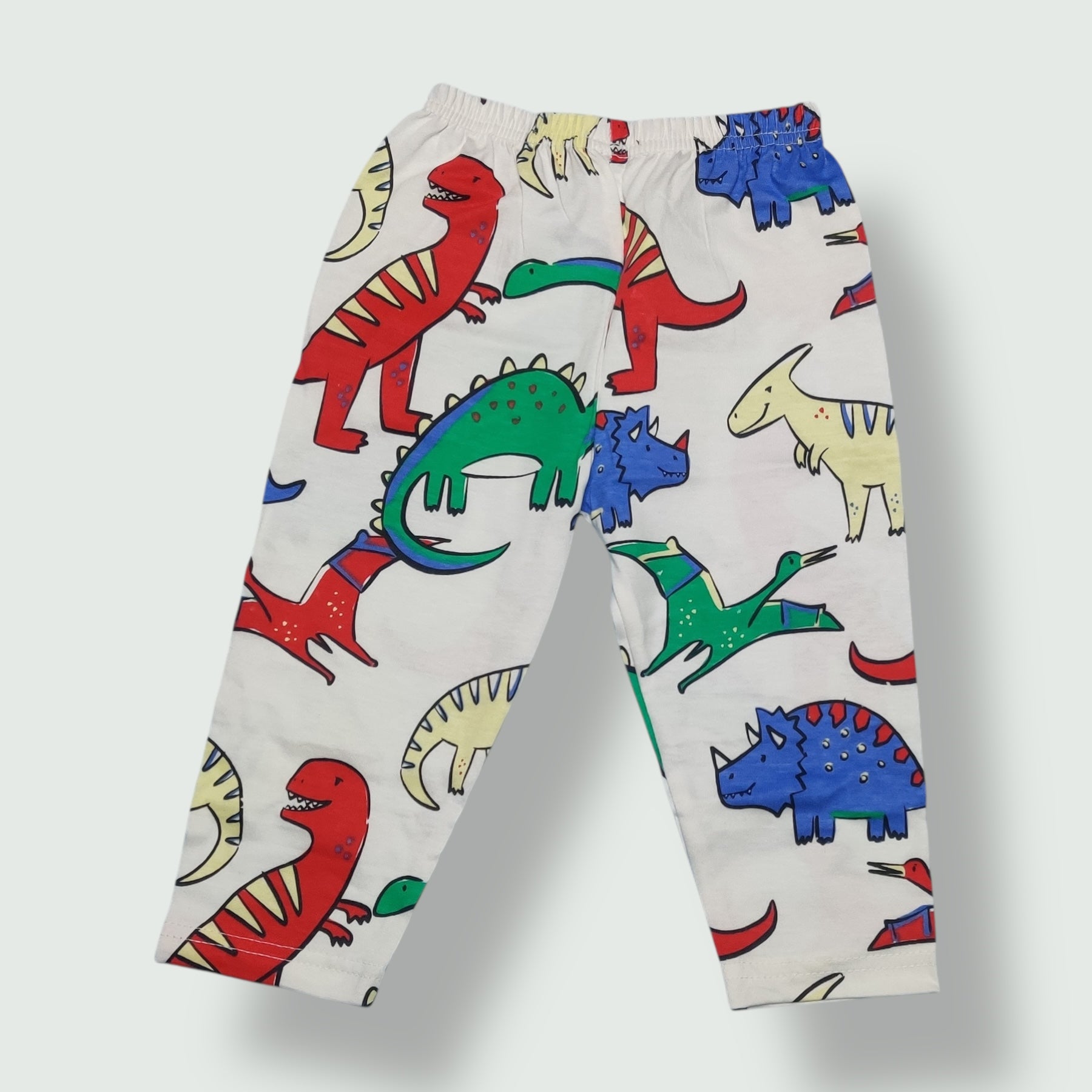 Frost white baby pant with colorful dinosaur prints front view