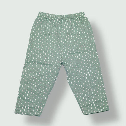 Mint green baby pant with white polka dot print front view