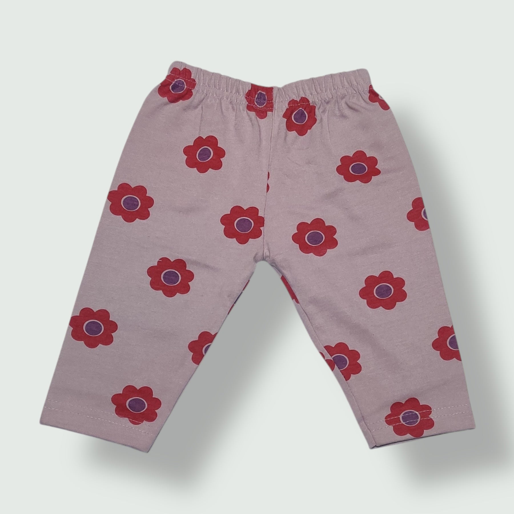 Pale mauve baby pant with red floral print front view