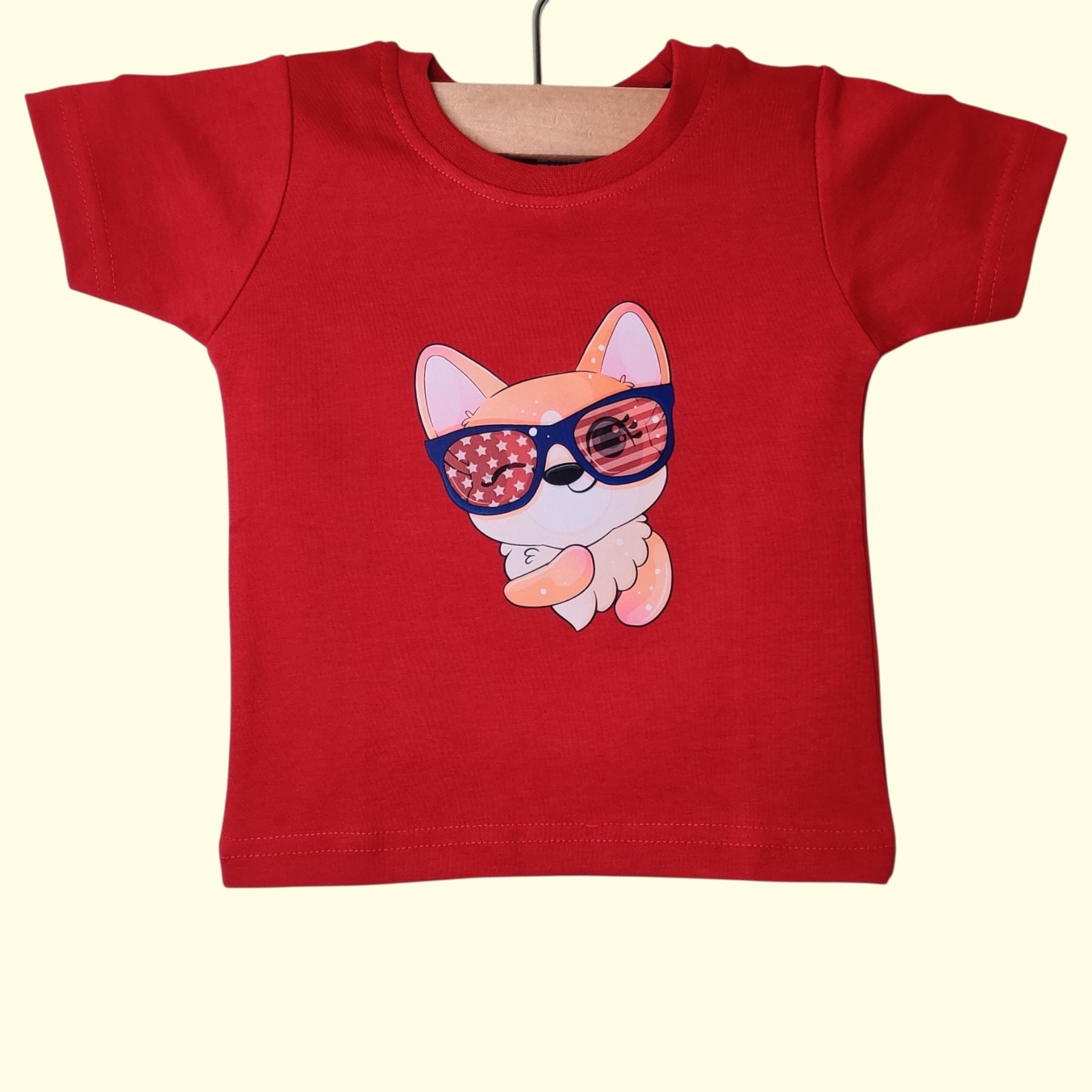 Red baby t-shirt with printed dog wearing sunglasses