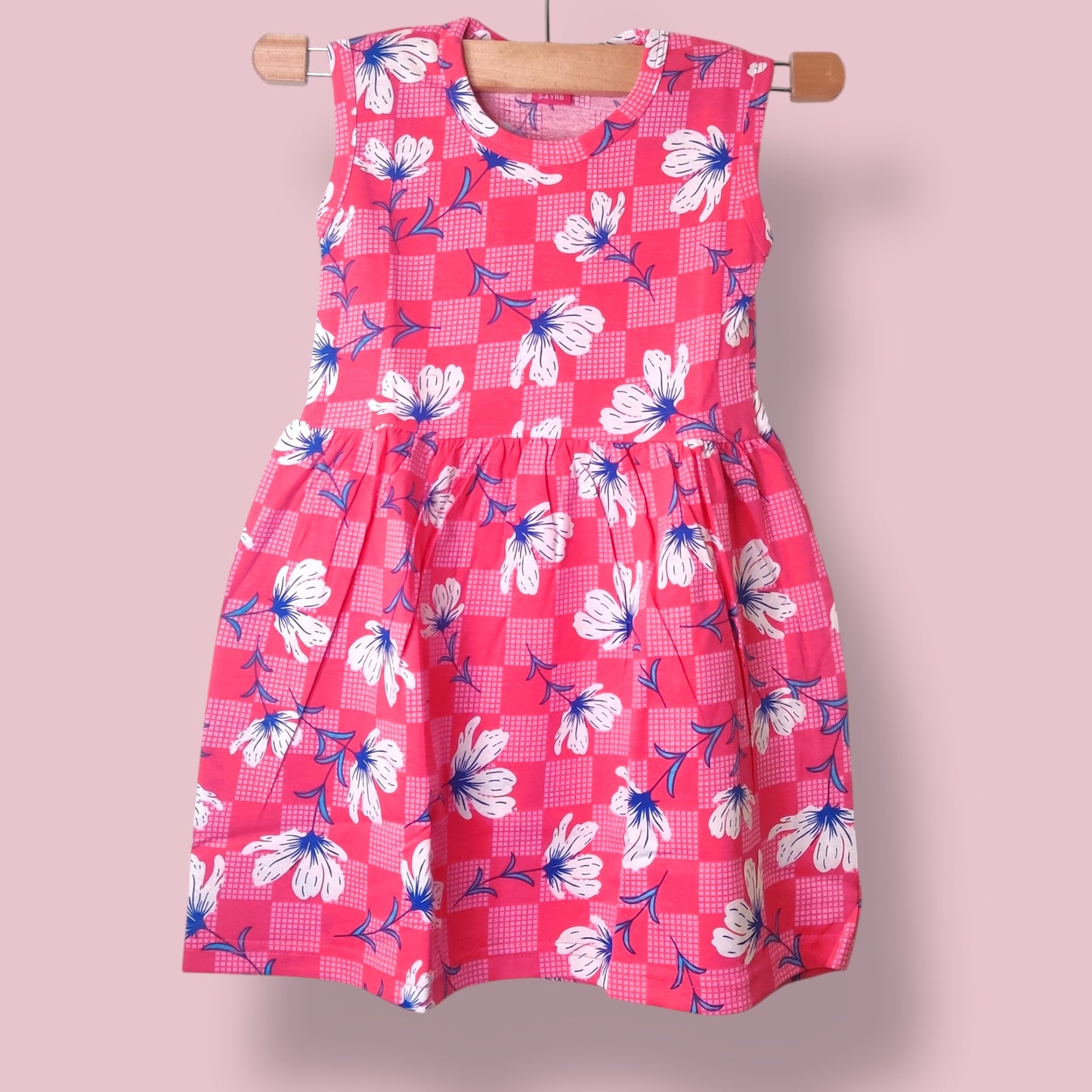 Blossom pink toddler sleeveless frock with all-over floral checkered print