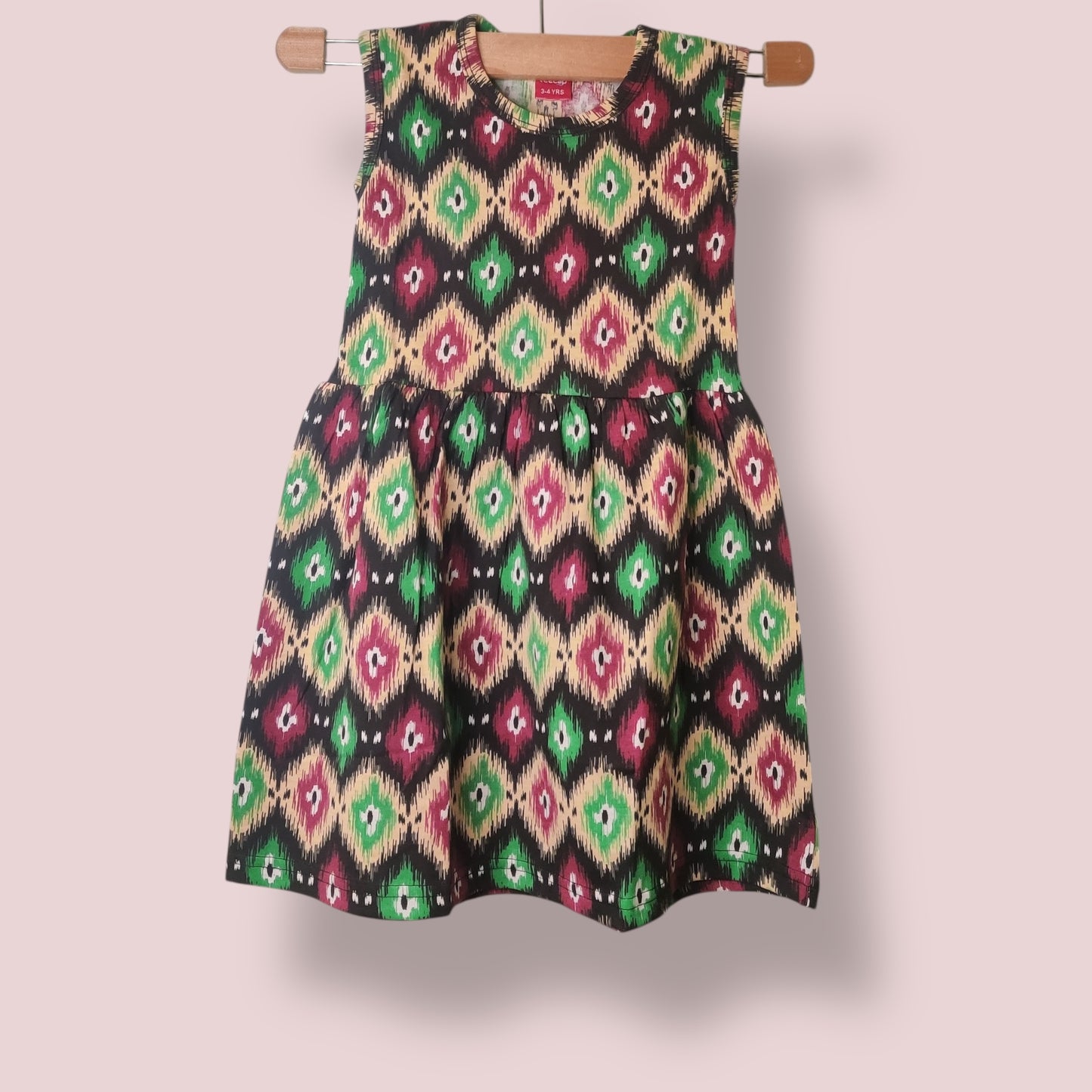 Classic black toddler sleeveless frock with all-over multicolor print