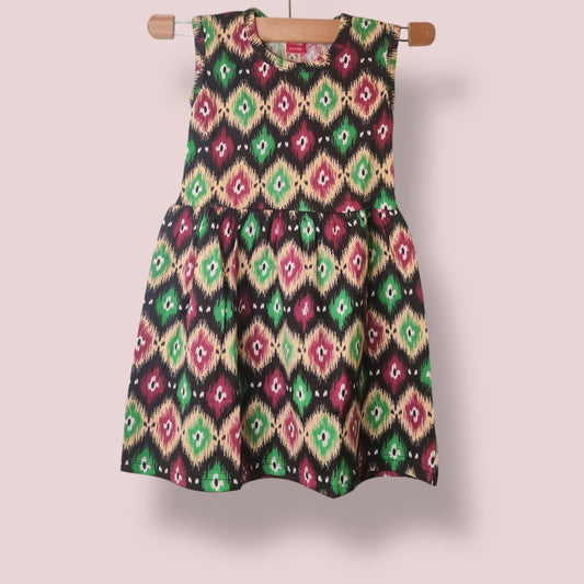 Classic black toddler sleeveless frock with all-over multicolor print