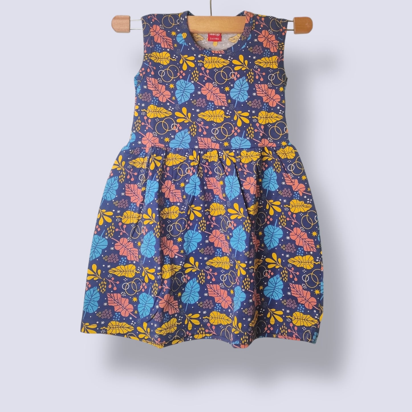 Navy breeze toddler sleeveless frock with all-over colorful leaf print