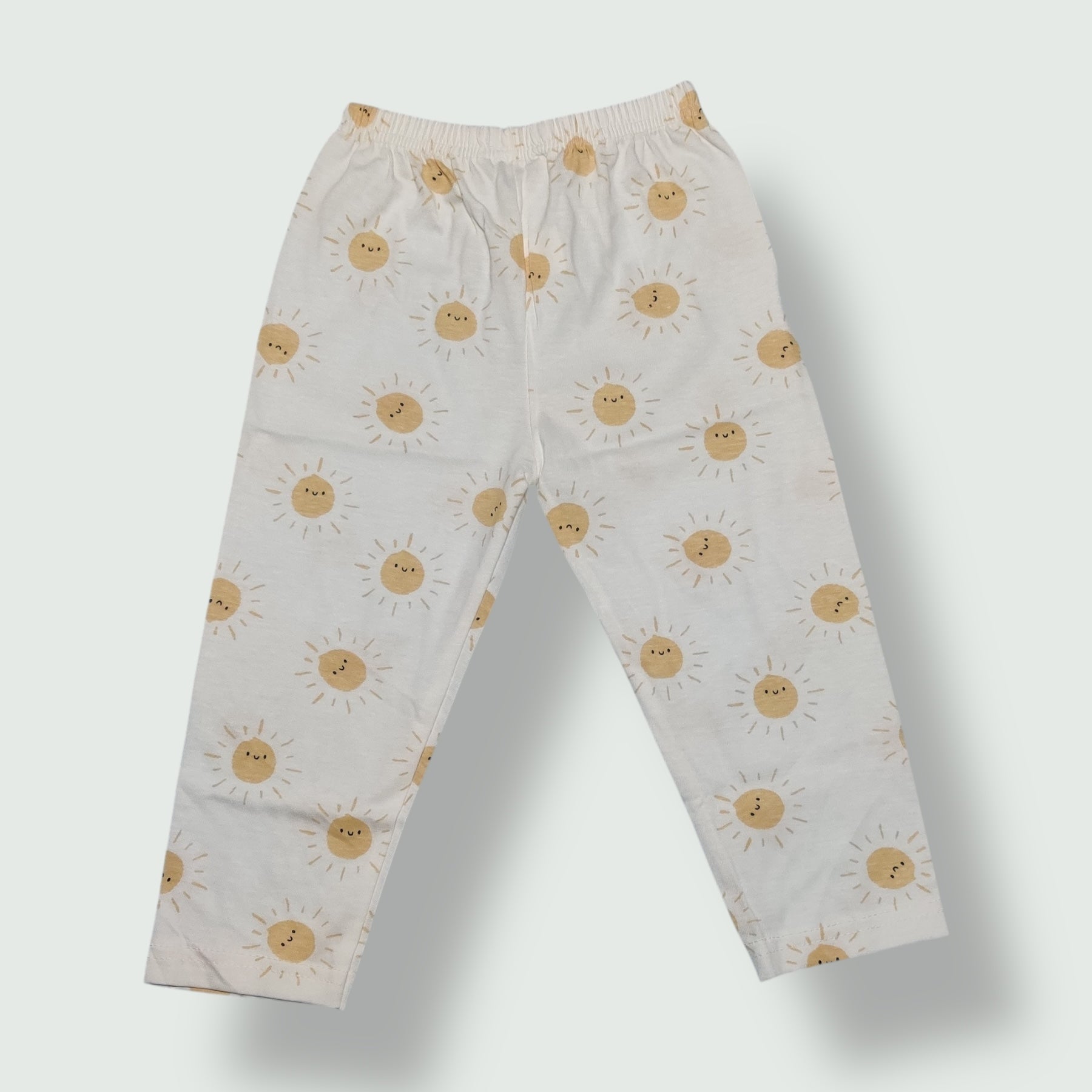 White baby pant with yellow sun printed design front view
